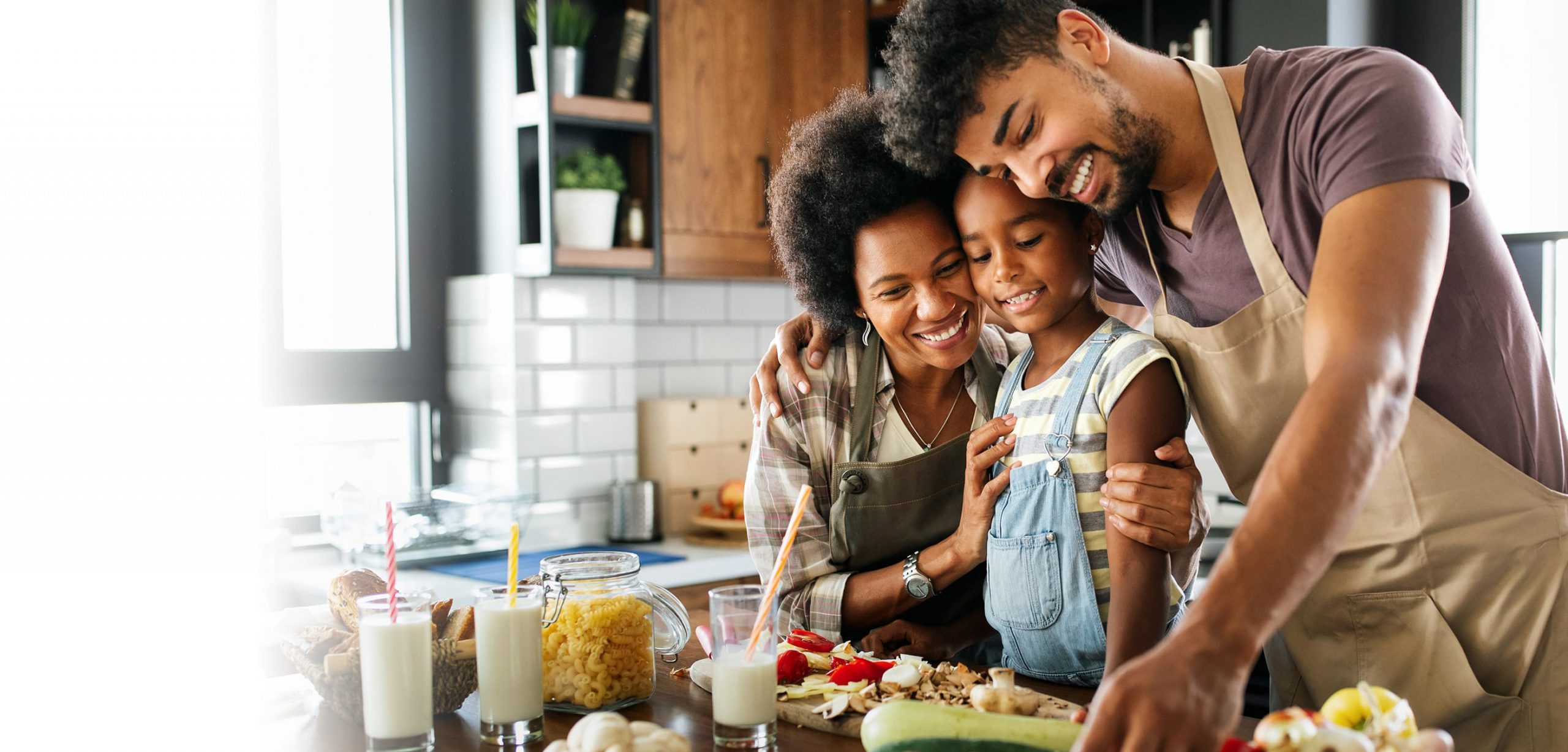 Happy family enjoying making a healthy meal together